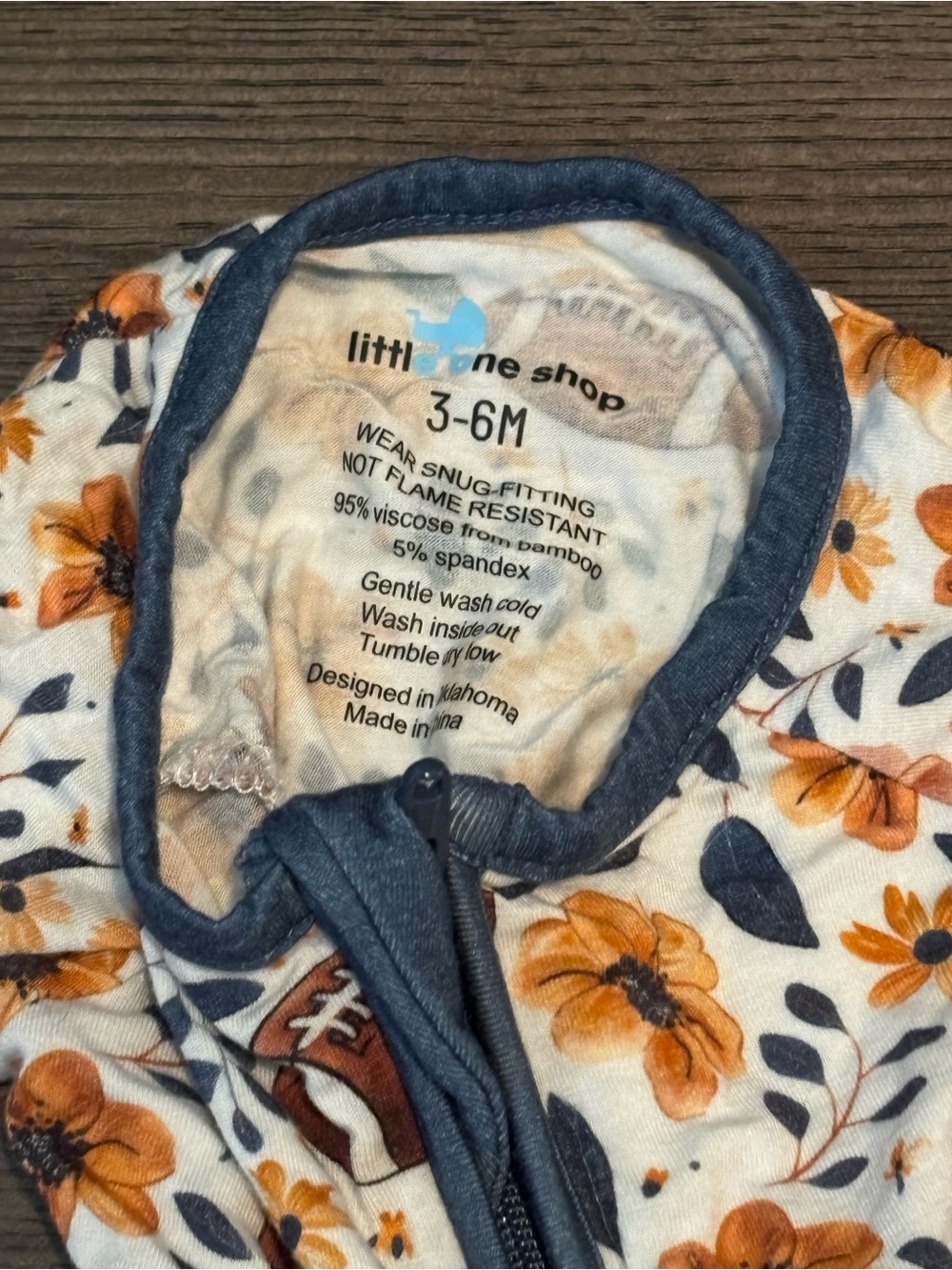 Children's Floral & Football Footed One-Piece in White and Orange with Navy Trim - Picture 3 of 4